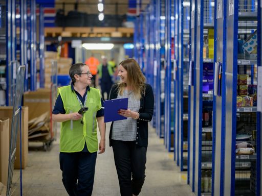 a man and a woman in a warehouse
